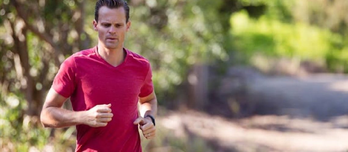 Man jogging with nerve pain