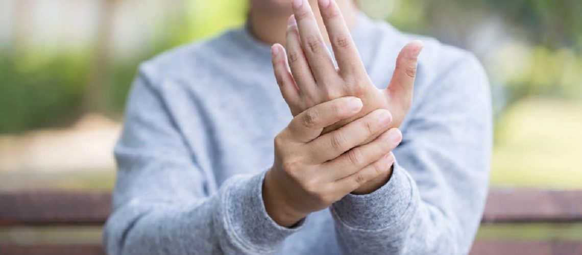 Woman with peripheral neuropathy in hands